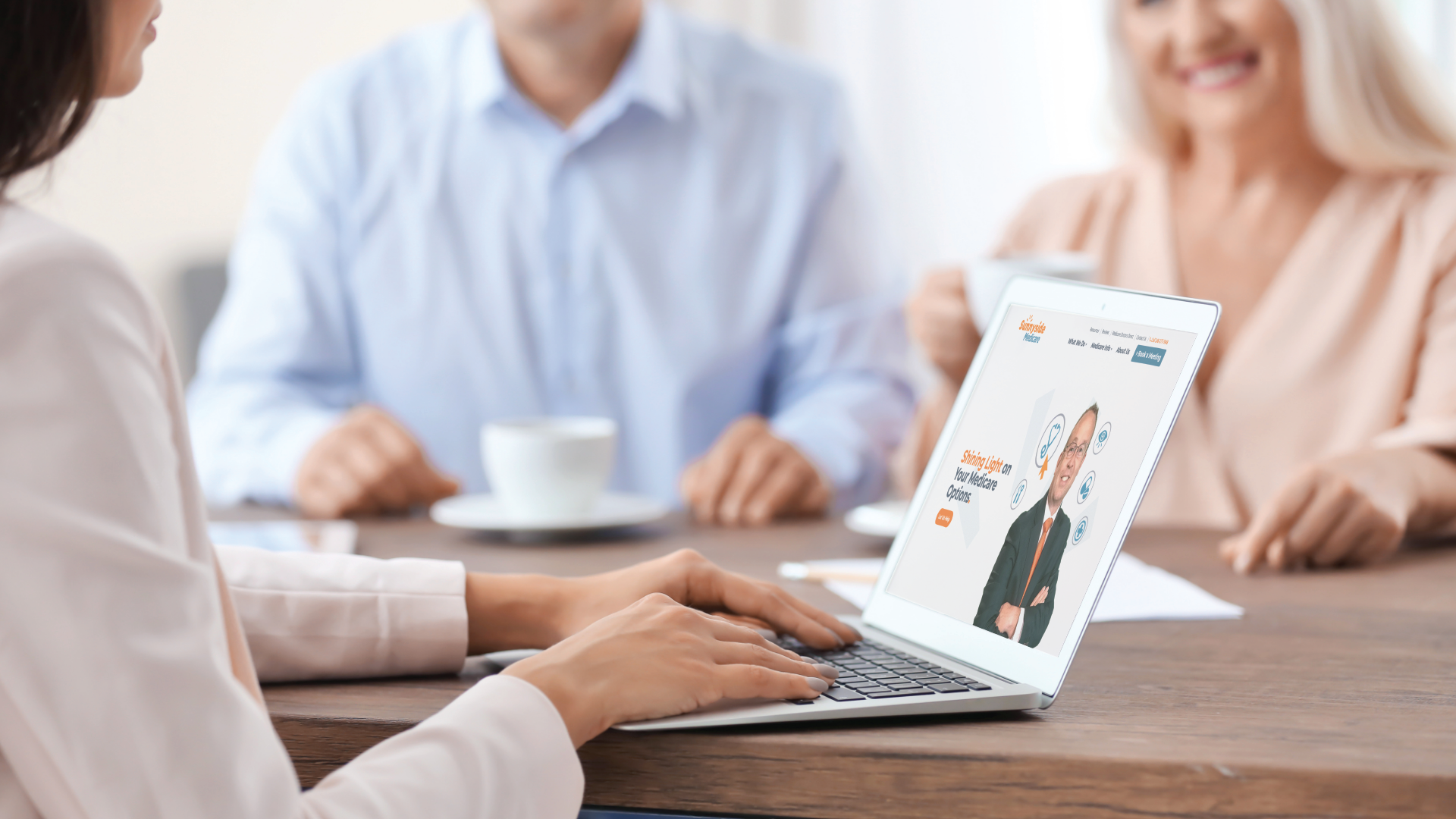 elder couple working with medicare insurance agent