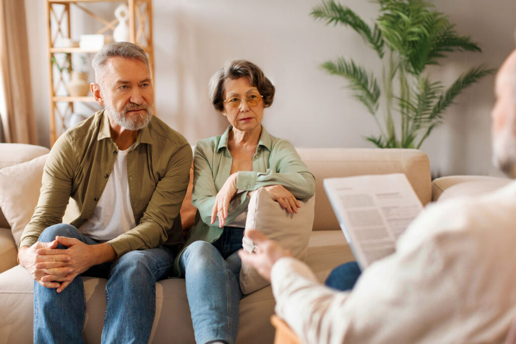Senior couple reviewing Medicare Advantage plan information with an advisor in Michigan.