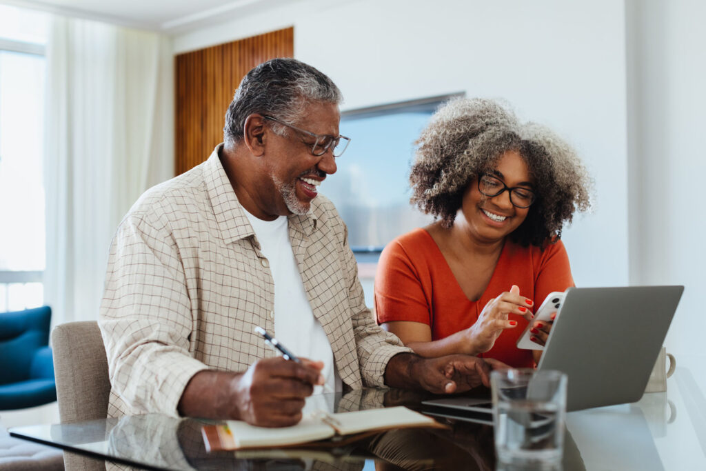 Senior couple reviewing Medicare prescription drug plan options online